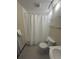 This bathroom has a shower over tub, sink, toilet and tiled floor and walls at 1203 Washington Ave # 201, Golden, CO 80401