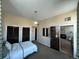 This bedroom offers carpet, hanging light and closet with doors leading to living space at 1203 Washington Ave # 201, Golden, CO 80401