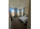 This bedroom features large windows with views and comfortable furnishings at 1203 Washington Ave # 201, Golden, CO 80401