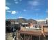 Rooftop view of a vibrant city street, showcasing picturesque buildings, mountains, and a bright blue skyline at 1203 Washington Ave # 201, Golden, CO 80401