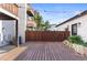 Expansive deck with string lights and a view of a fenced backyard at 63 Harrison St, Denver, CO 80206