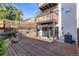 Large deck overlooks a fenced backyard with raised garden beds at 63 Harrison St, Denver, CO 80206