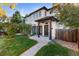 Two-story home with front yard and walkway at 63 Harrison St, Denver, CO 80206