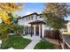 Two-story home with front yard and walkway at 63 Harrison St, Denver, CO 80206