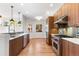 Modern kitchen with wood cabinets and stainless steel appliances at 63 Harrison St, Denver, CO 80206