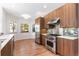 Modern kitchen with wood cabinets and stainless steel appliances at 63 Harrison St, Denver, CO 80206