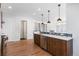 Modern kitchen with stainless steel appliances and hardwood floors at 63 Harrison St, Denver, CO 80206