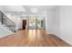 Hardwood floors, French doors and staircase in living room at 63 Harrison St, Denver, CO 80206