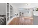 Living area with fireplace, hardwood floors, and built-in shelving at 63 Harrison St, Denver, CO 80206