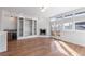 Sunlit living room with hardwood floors and built-in shelving at 63 Harrison St, Denver, CO 80206