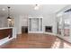 Living room with fireplace, built-ins, and hardwood floors at 63 Harrison St, Denver, CO 80206