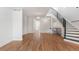 Open living area with hardwood floors and staircase at 63 Harrison St, Denver, CO 80206