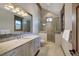 Elegant bathroom with walk-in shower, double vanity with marble countertop, and modern lighting at 422 Timber Trail Rd, Breckenridge, CO 80424