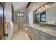Beautiful bathroom featuring a glass-enclosed shower, marble countertop, and stylish fixtures at 422 Timber Trail Rd, Breckenridge, CO 80424