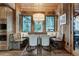 Eat-in dining area with built-in bench seating, wood paneled walls and mountain views at 422 Timber Trail Rd, Breckenridge, CO 80424
