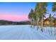 Idyllic slopeside log home with picturesque ski slope views, complemented by a backdrop of mountains and lush forest at 422 Timber Trail Rd, Breckenridge, CO 80424