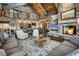 Inviting living room featuring a fireplace and views of the kitchen and second story loft at 422 Timber Trail Rd, Breckenridge, CO 80424