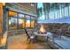 Inviting outdoor patio with stone fire pit, seating area, and views of the surrounding landscape at 422 Timber Trail Rd, Breckenridge, CO 80424
