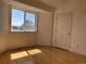 Unfurnished bedroom bathed in sunlight, featuring beautiful wood floors at 1339 Sumner St # B, Longmont, CO 80501