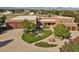 Aerial view of southwest style estate, circular driveway, landscaping and mountain views at 4719 Beverly Ln, Erie, CO 80516