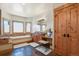 A luxurious primary bath boasts a soaking tub, vanity, and natural wood accents at 4719 Beverly Ln, Erie, CO 80516