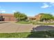 Landscaped front yard with circular drive and southwest-style home with large garage at 4719 Beverly Ln, Erie, CO 80516