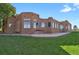 Back of home featuring stucco exterior, copper gutters and downspouts and mature trees at 4719 Beverly Ln, Erie, CO 80516
