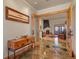 Welcoming foyer featuring slate floors, wood trim, and view to the living room at 4719 Beverly Ln, Erie, CO 80516