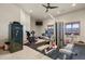 Home gym with a variety of exercise equipment and a ceiling fan for ventilation at 4719 Beverly Ln, Erie, CO 80516
