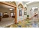 Hallway leading to the primary bedroom with wooden floors and light streaming in at 4719 Beverly Ln, Erie, CO 80516