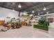 Large hangar with various equipment, including tractors and an airplane, for storage and maintenance at 4719 Beverly Ln, Erie, CO 80516