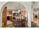 Gourmet kitchen features a large island with seating, granite countertops, and custom cabinetry at 4719 Beverly Ln, Erie, CO 80516