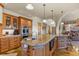 Spacious kitchen island boasts granite countertops, custom cabinets, and stainless steel appliances at 4719 Beverly Ln, Erie, CO 80516