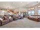 Spacious living room with carpet, large windows and comfortable seating at 4719 Beverly Ln, Erie, CO 80516