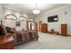 Spacious bedroom with a four-poster bed, ample closet space, and natural light at 4719 Beverly Ln, Erie, CO 80516