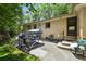 Outdoor patio with grill, seating area, and a view of the home's exterior at 6050 Marshall Ct, Arvada, CO 80003