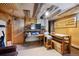 Finished basement features drop ceiling, media area, and custom shelving at 6050 Marshall Ct, Arvada, CO 80003