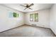 Bright bedroom with two windows and neutral carpet, ready for personalization at 6050 Marshall Ct, Arvada, CO 80003
