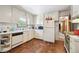 Classic kitchen with white appliances and cabinets, perfect for home cooking at 6050 Marshall Ct, Arvada, CO 80003
