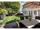 Inviting backyard with a patio area featuring an outdoor dining set and a view of the home's exterior at 521 N Fairfax St, Denver, CO 80220