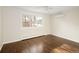 Bright bedroom with hardwood floors, large window, and modern cooling system at 521 N Fairfax St, Denver, CO 80220