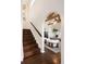 Elegant entryway with dark wood stairs, arched doorway, and a cozy living space at 521 N Fairfax St, Denver, CO 80220