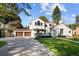 Beautiful home boasting a well-maintained lawn, an inviting driveway, and a detached garage with a basketball hoop at 521 N Fairfax St, Denver, CO 80220