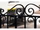 Close-up of the ornate iron gate, showcasing its intricate design and elegant craftsmanship at 521 N Fairfax St, Denver, CO 80220