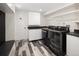 Well-organized laundry room with modern appliances, storage cabinets, and stylish flooring at 521 N Fairfax St, Denver, CO 80220