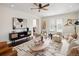 Cozy living room with modern decor, stylish furniture, and a ceiling fan for added comfort at 521 N Fairfax St, Denver, CO 80220