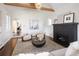 Bright living room featuring stylish furnishings, fireplace, and an open floor plan at 521 N Fairfax St, Denver, CO 80220
