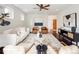 Bright living room with modern furnishings, hardwood floors, and a sleek ceiling fan at 521 N Fairfax St, Denver, CO 80220