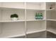 Spacious walk-in pantry with white shelving and ample storage for an organized kitchen at 521 N Fairfax St, Denver, CO 80220