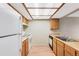 Bright kitchen featuring hardwood flooring, good lighting, and white appliances at 4896 S Dudley St # 4-7, Littleton, CO 80123